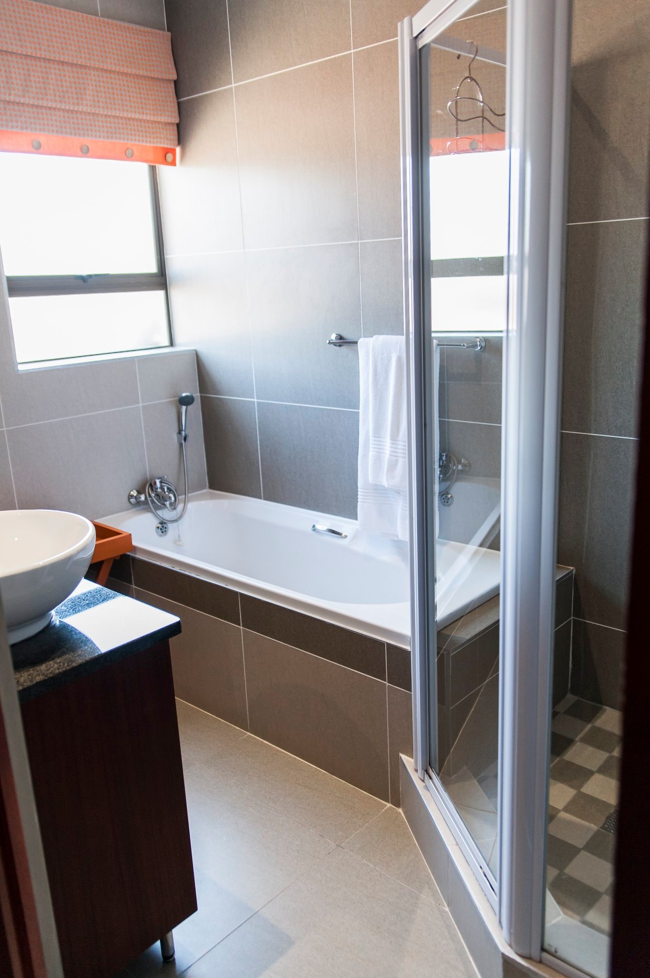 Bathtub and a shower. Newly renovated.